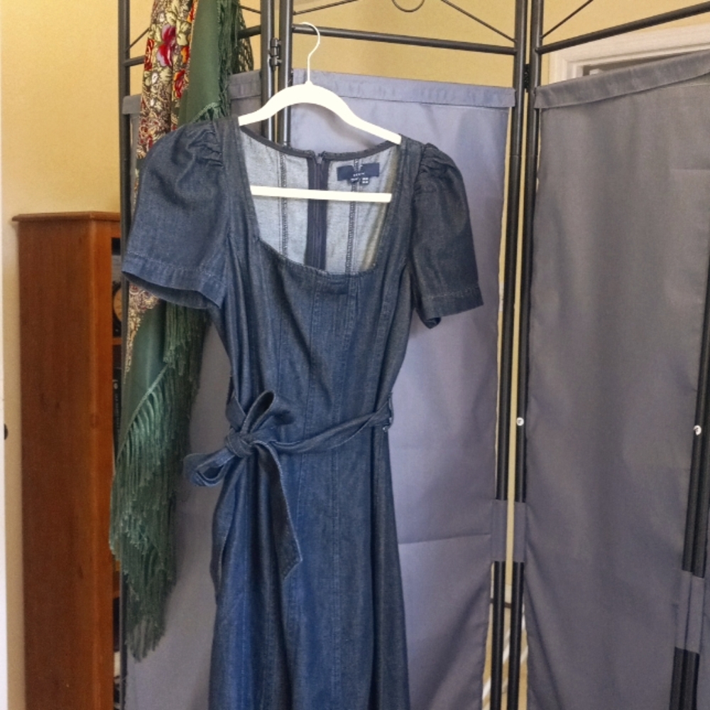 A dark blue cotton/tender denim blend midi dress.